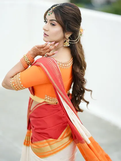 Another elegant side profile. The simple yet beautiful henna design is a key part of her festive ensemble.