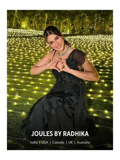 Kriti Sanon making a heart sign, sharing the love while wearing one of my signature choker necklaces at a family wedding.