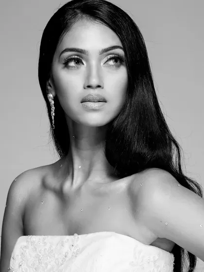 A black and white close-up of the model from the white gown shoot, creating a timeless and classic beauty portrait.