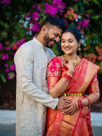 A warm and loving embrace between Devika and Laukik, their smiles telling the whole story.