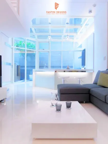 This shot captures the open and airy feel of the living space, looking towards the kitchen and courtyard. The glass ceiling and large windows flood the room with natural light, which was a key part of my design.