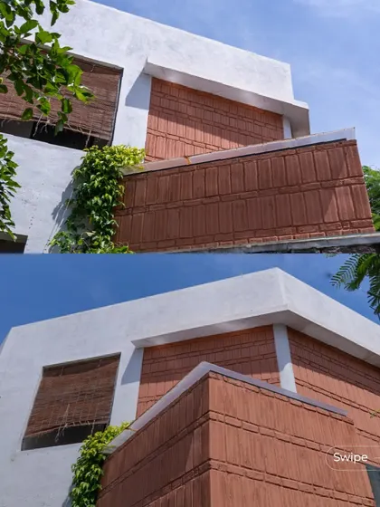 The facade of the Gifty Residence combines clean white plaster with the earthy red of terracotta blocks, creating a modern yet warm exterior. The bamboo blinds add another layer of natural texture.