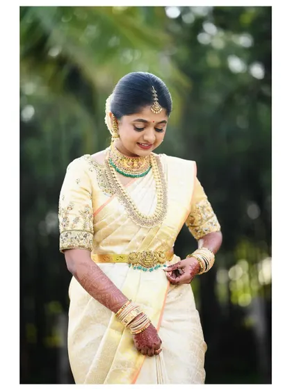 Another beautiful shot of Nithu, capturing the timeless grace of her wedding attire.