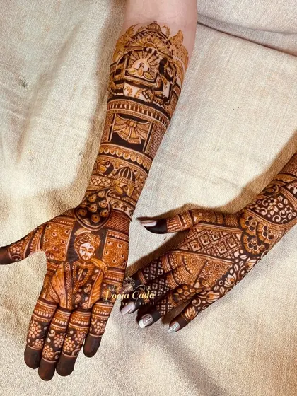 A different angle of the Dubai bride's henna, showing the groom's portrait and the intricate back-hand design.
