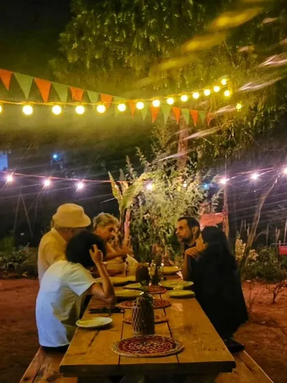 An evening dinner party in full swing. The warm lights and rustic setting make our farm the perfect venue for any celebration.