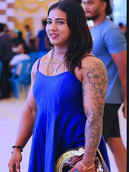 A candid shot from an event, holding my championship belt. A reminder of the hard work and dedication.