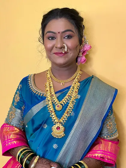 Samata's second look for her wedding ceremonies, wearing a beautiful blue and pink saree. The makeup was adapted to complement the new colors.