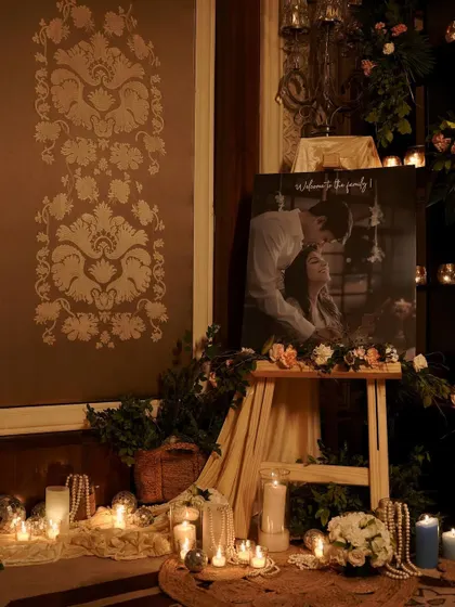 A closer look at the personalized photo display. The warm candlelight illuminates the couple's portrait, creating a beautiful and romantic focal point.