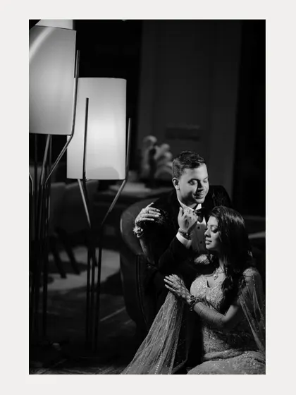 A tender black and white moment from an engagement party. This classic style emphasizes the emotion and connection between the couple.