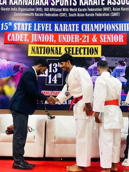 A moment of respect and recognition as a student receives his award at the state championship.