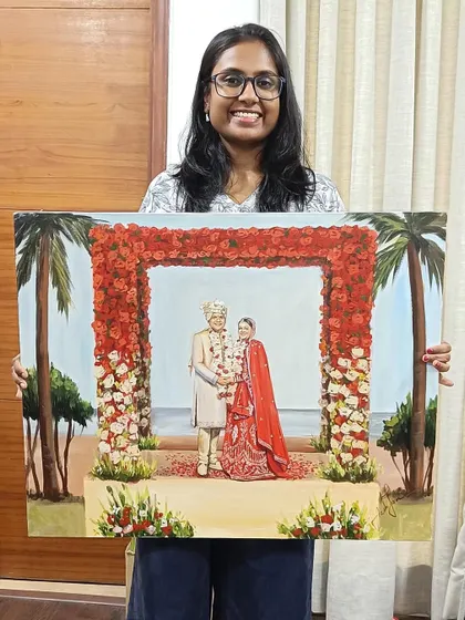 A proud moment holding the finished Goa beach wedding painting. After hours of live work and studio detailing, it's ready to be delivered to the couple.