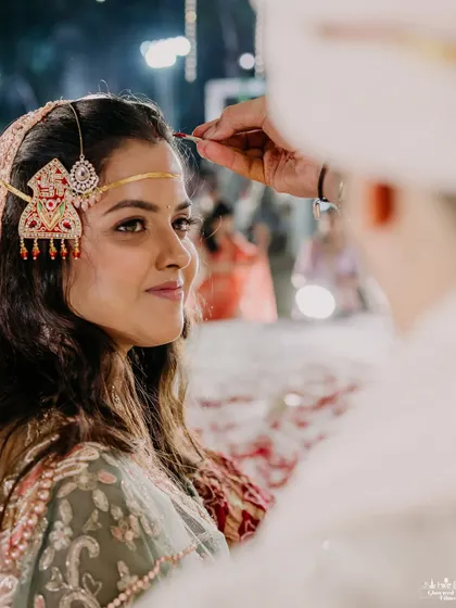 An intimate close-up of the sindoor ceremony. Even in the grandest of weddings, I ensure the focus remains on these personal, emotional moments that define your union.