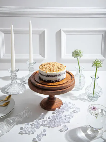A wider view of our crumb-topped ice cream cake, set on a beautifully styled table. Ice cream cakes are always a good idea.