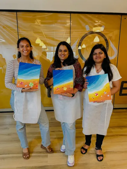 Three colleagues showing off their finished paintings. It's always great to see the different interpretations of the same theme.