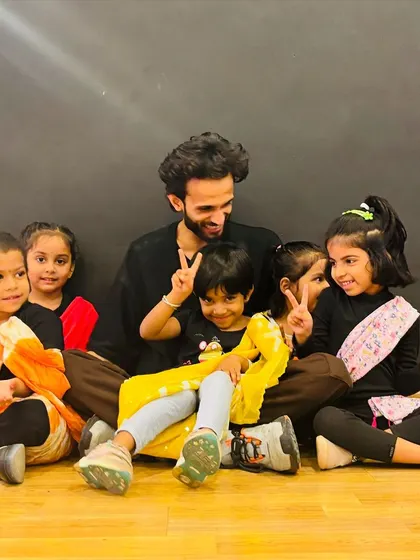 All smiles after a great dance session. Our instructor Akshay with the Little Groovers, who attend class on Mondays, Wednesdays, and Fridays. We focus on creating a positive and happy space for kids to learn.