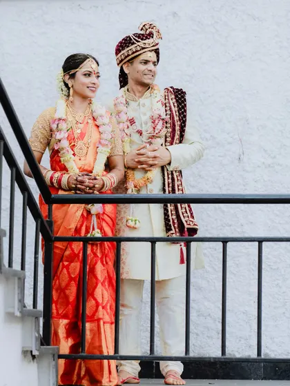 A classic wedding portrait of the couple on a staircase. We use the architecture of the venue to frame our subjects and create elegant compositions.