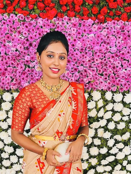 A beautiful portrait of our client, her smile as bright as her outfit.