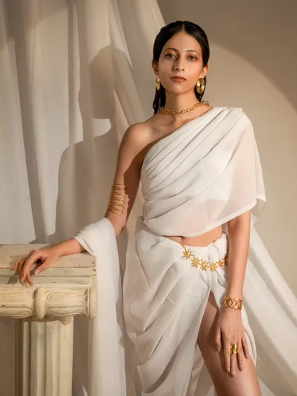 A close-up from the ethereal jewelry campaign, highlighting the model's expression and the delicate details of the accessories.