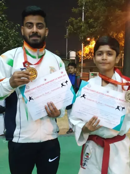 Two more gold medalists from the district championship. We focus on developing talent across all age groups, from young juniors to senior competitors.