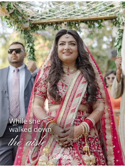A beautiful shot of the bride walking down the aisle, her face lit up with a smile as she approaches her new beginning.