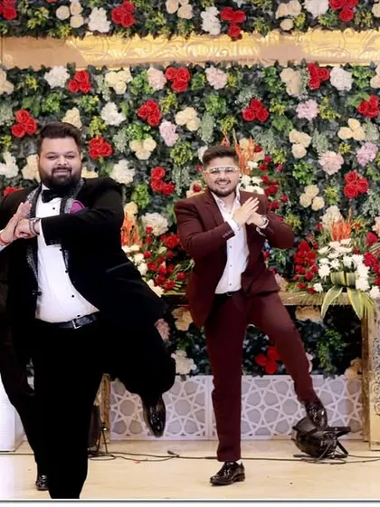 The groom and his groomsmen celebrating with a synchronized dance performance. We capture these fun, high-energy moments that make your event memorable.
