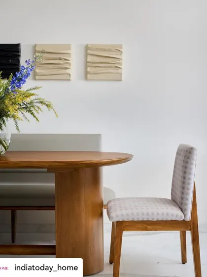 A detail shot from our 'House on the Hill' feature, focusing on the textures and materials in the dining area. The combination of wood, soft upholstery, and textured art creates a layered and sophisticated look.