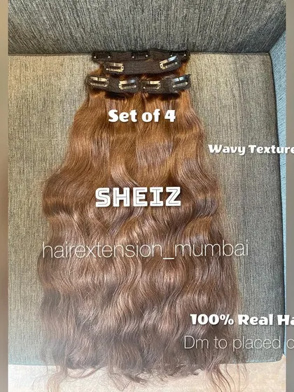 A set of 4 wavy clip-on extensions. We can customize the color, length, and texture for any order.