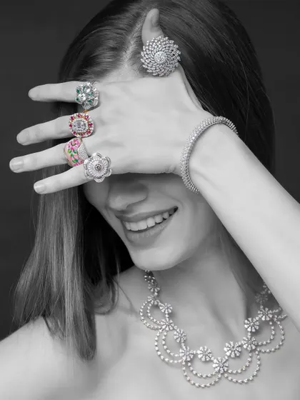 A playful and candid-style shot for Yoube Jewellery. The monochrome treatment keeps the focus on the incredible sparkle of the diamond rings and necklace, while the model's smile adds a touch of joy and personality.