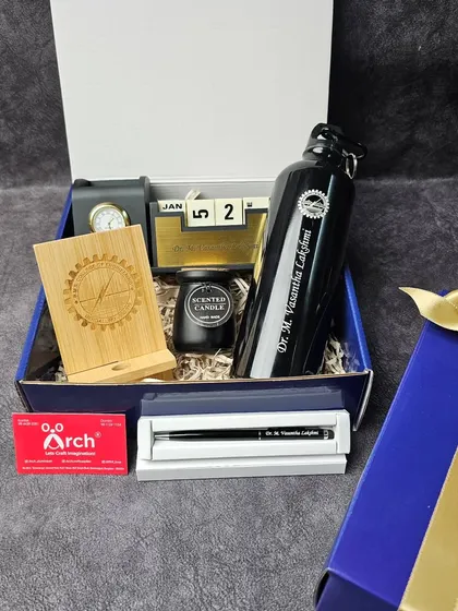 This bespoke corporate gift hamper was designed for the faculty at BMS Institute. It includes a personalized water bottle, a desk calendar, a scented candle, and other useful items to support their daily workflow.