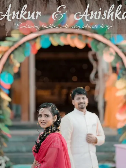 A lovely portrait of the couple at their Mehendi or Haldi function, framed by a colorful, quirky entrance arch. It captures the fun and festive theme of the event.