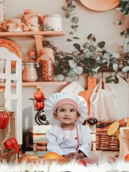 A sweet little chef in a beautifully detailed kitchen setup. The shelves are stocked with spices and ingredients, creating a realistic and charming scene.