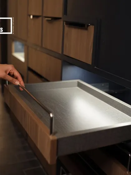 This shallow pull-out tray is perfect for organizing smaller items. The sleek design and smooth gliding mechanism demonstrate my commitment to functional details that improve your daily routine.