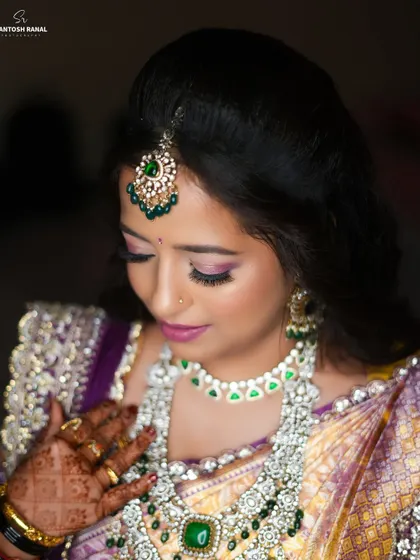 A classic bridal portrait capturing the elegance of the bride and her exquisite jewelry.