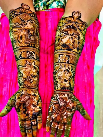A full bridal design with multiple portraits, including the couple, family, and Ganesha.