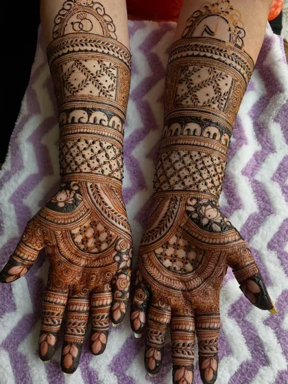 The full view of the engagement mehendi, with its intricate patterns and auspicious symbols. A perfect start to the wedding celebrations.