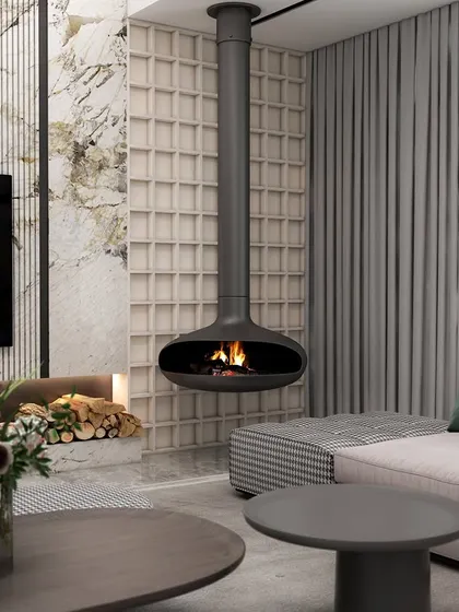 A close-up of the suspended fireplace, a feature that adds both warmth and a strong design statement. We paired it with a textured marble wall and a custom-built log storage niche, blending raw elements with polished design for a sophisticated yet cozy corner.