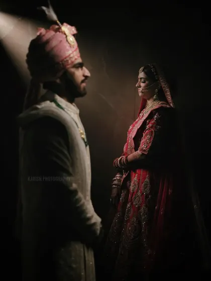 A dramatic couple portrait using a single light source to create a moody, intimate atmosphere. This highlights my artistic approach to wedding photography, focusing on emotion and connection.