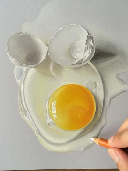 A realistic drawing of a broken egg. The challenge here was to capture the different textures of the smooth yolk, the translucent egg white, and the brittle, cracked shell.