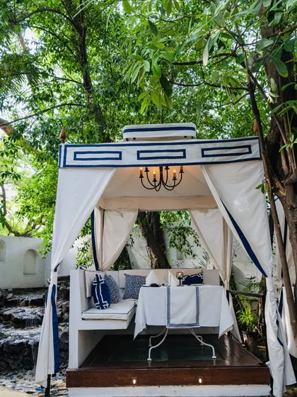 A daytime view of one of our cabanas, showcasing the crisp white and blue decor that evokes the feeling of the Mediterranean coast.