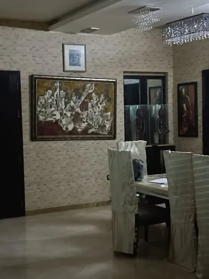 The dining area of the artist's home. My Vastu analysis also covers the placement of furniture and art in common areas to promote family harmony and positive social interactions.