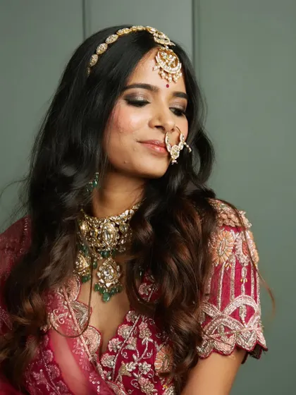 A close-up of the complete traditional bridal look, including the nath (nose ring). Every detail is crafted to perfection for her special day.