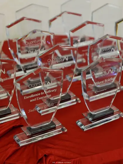 The awards are ready to be presented at the Quantum Street AI event. I ensure the awards ceremony is a perfect mix of formal recognition and fun celebration.