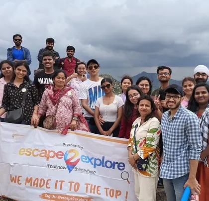 We made it to the top! The group celebrating after a small hike during the Adiyogi-Lepakshi day trip.