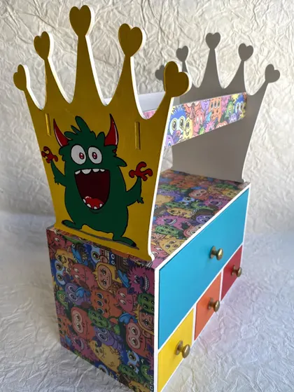 A full view of the monster-themed hair accessory organizer, a practical and playful addition to a child's room.