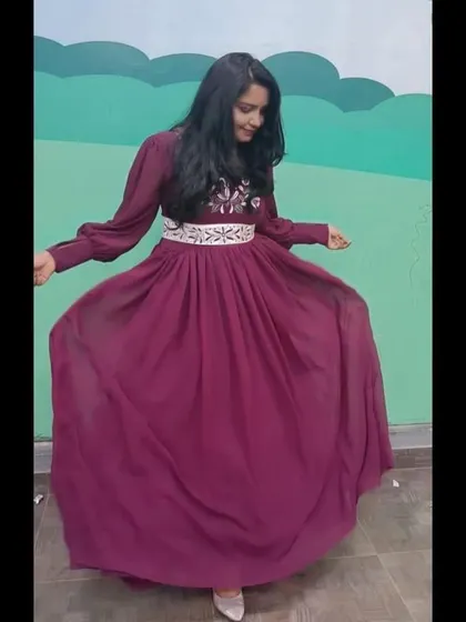 The client twirling in her custom Christmas gown. The georgette fabric has a beautiful flow.