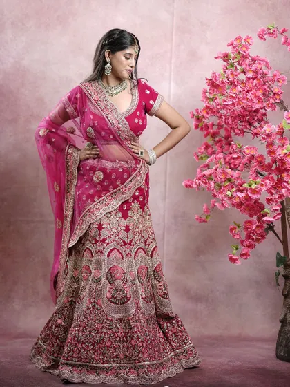The full view of the magenta bridal lehenga, showcasing its grand flare and detailed craftsmanship.