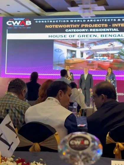 A view from the audience at the Construction World Architect and Builder (CWAB) Awards ceremony, with "House of Greens" featured on screen.