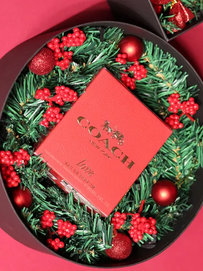 Another angle of the Coach perfume Christmas gift, showing the full circular presentation.