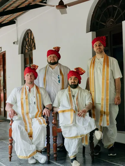 Groomsmen from abroad looking regal in traditional Indian turbans and attire for their friend's wedding.