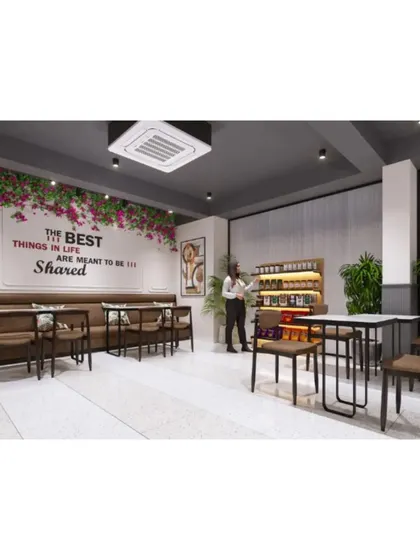 A comfortable seating area with a motivational quote on the wall, "The best things in life are meant to be shared."